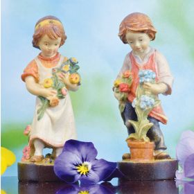 BOY WITH FLOWER POT FIGURINE