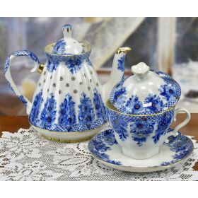 COBALT BLUE AND WHITE FLORAL DESIGN TEA POT, CUP AND SAUCER WITH LID